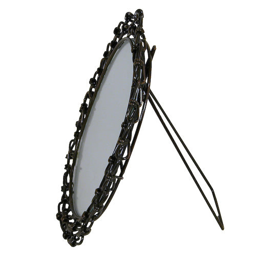 Handcrafted oval mirror framed with recycled link chains, showcasing unique artisan craftsmanship from India.