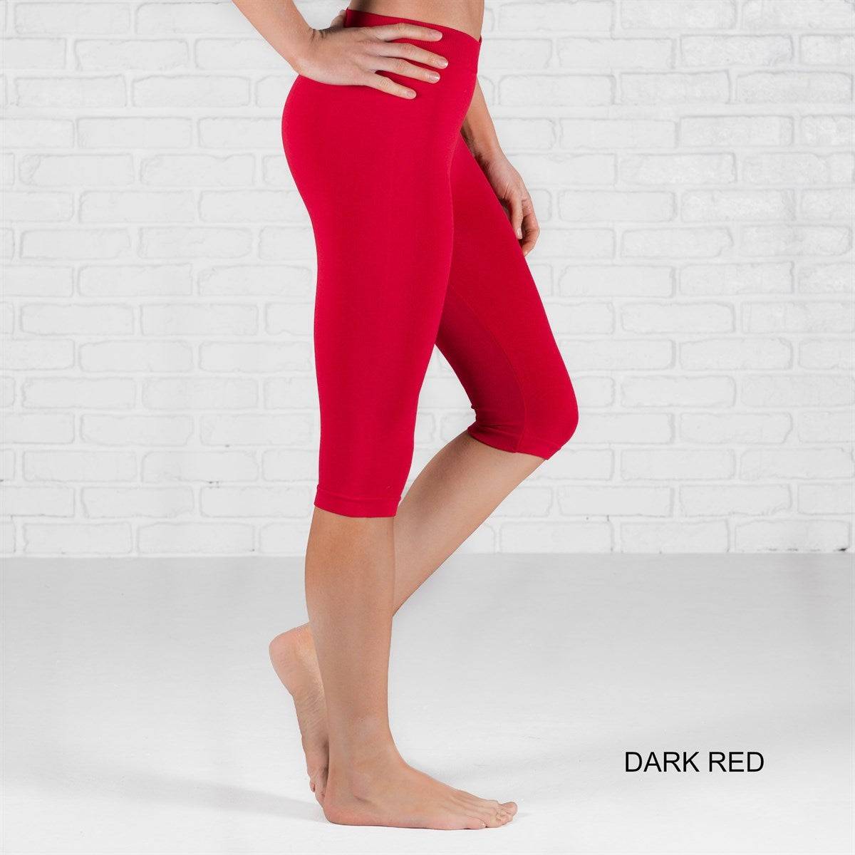 Over Knee Crop Shorts Leggings in various colors, showcasing their stretchy fabric and over-the-knee design.