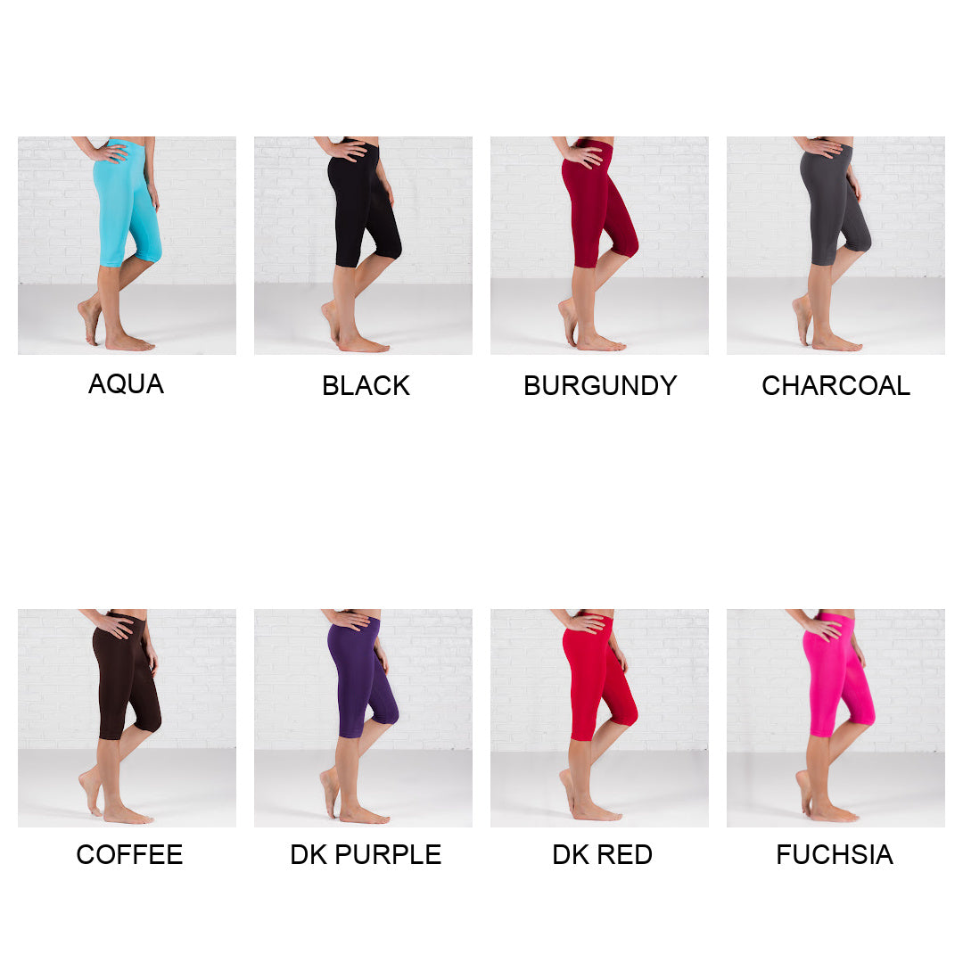 Over Knee Crop Shorts Leggings in various colors, showcasing their stretchy fabric and over-the-knee design.