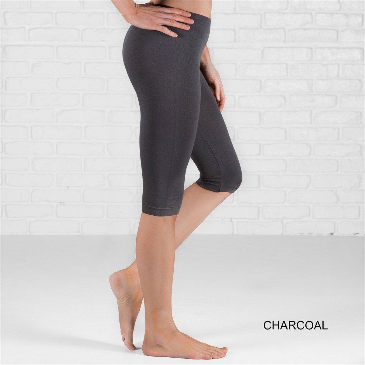 Over Knee Crop Shorts Leggings in various colors, showcasing their stretchy fabric and over-the-knee design.