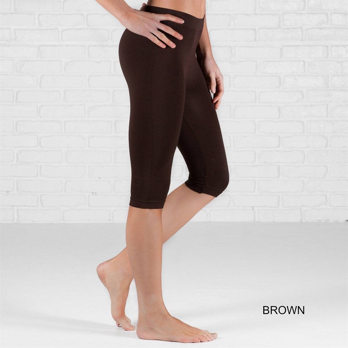 Over Knee Crop Shorts Leggings in various colors, showcasing their stretchy fabric and over-the-knee design.