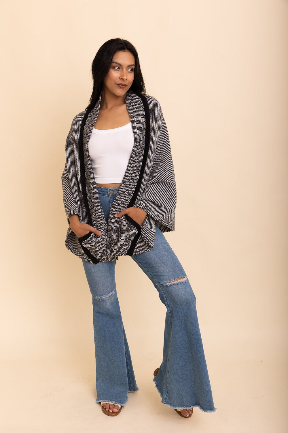 Cozy Over The Shoulder Knitted Shawl in various colors, featuring an oversized fit and pockets, perfect for stylish layering.