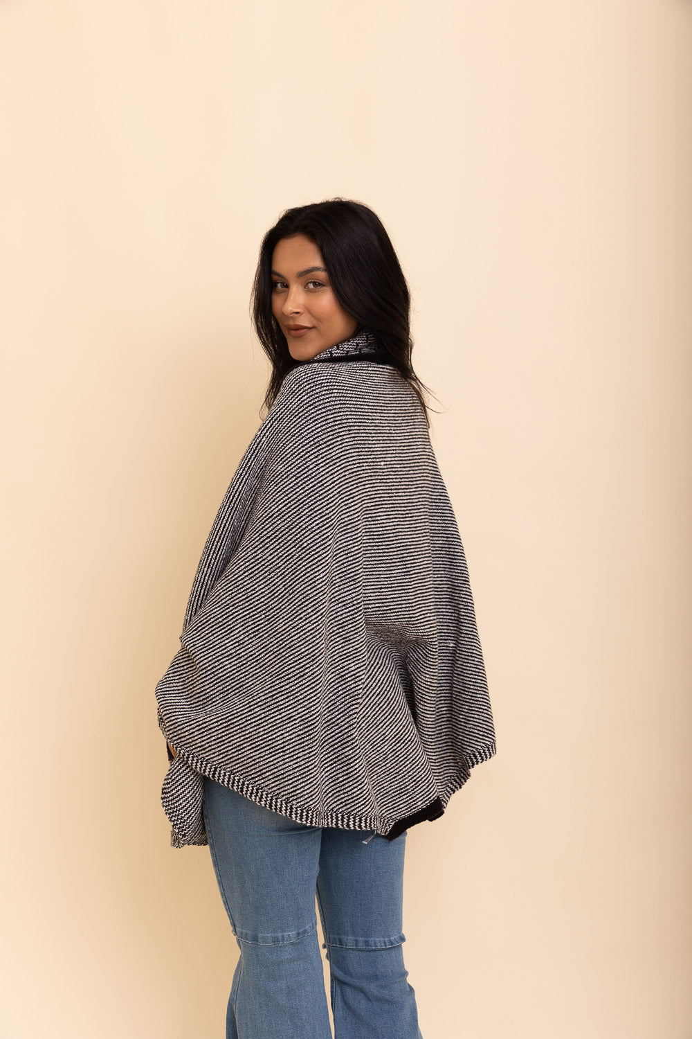 Cozy Over The Shoulder Knitted Shawl in various colors, featuring an oversized fit and pockets, perfect for stylish layering.