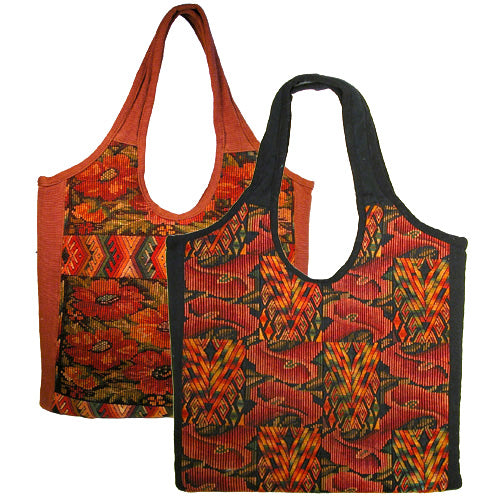 Overdyed Huipil Handbag showcasing vibrant colors and traditional Guatemalan textile patterns, featuring a magnetic clasp and interior pockets.