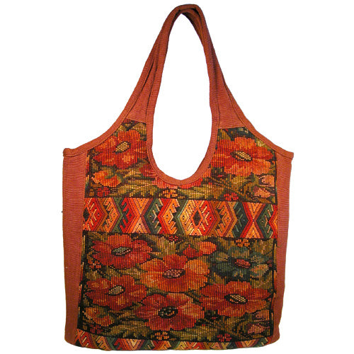 Overdyed Huipil Handbag showcasing vibrant colors and traditional Guatemalan textile patterns, featuring a magnetic clasp and interior pockets.