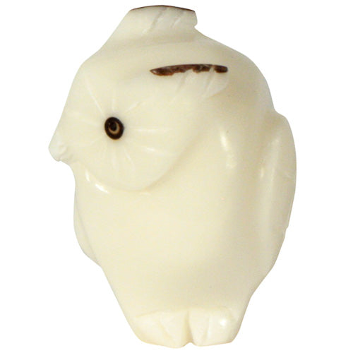 Hand-carved owl figurine made from tagua nuts, showcasing natural colors and intricate details, symbolizing eco-friendliness and artisan craftsmanship.