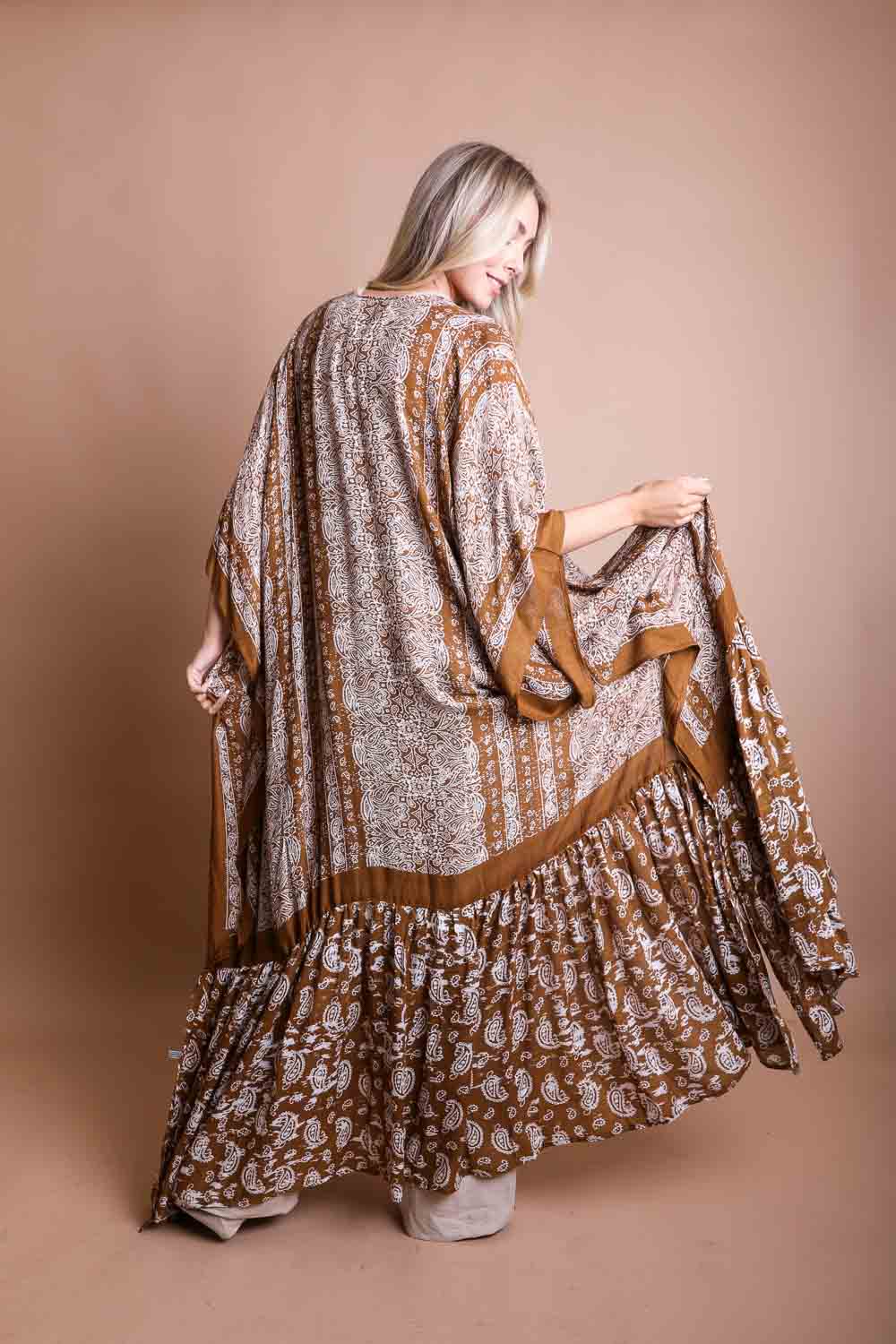 A stylish Paisley Free Flow Kimono featuring vibrant paisley patterns in flowy fabric, perfect for summer wear.