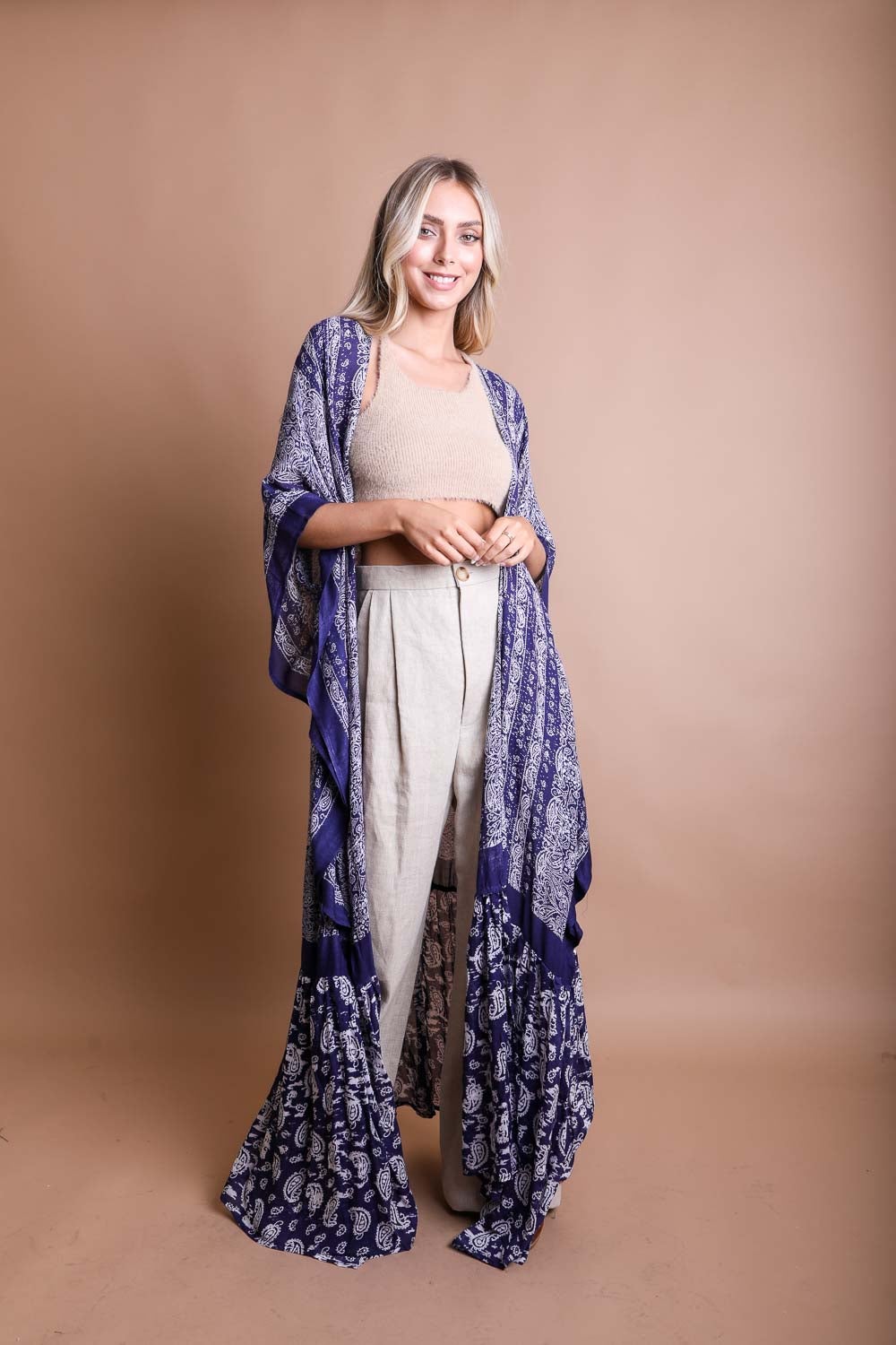 A stylish Paisley Free Flow Kimono featuring vibrant paisley patterns in flowy fabric, perfect for summer wear.