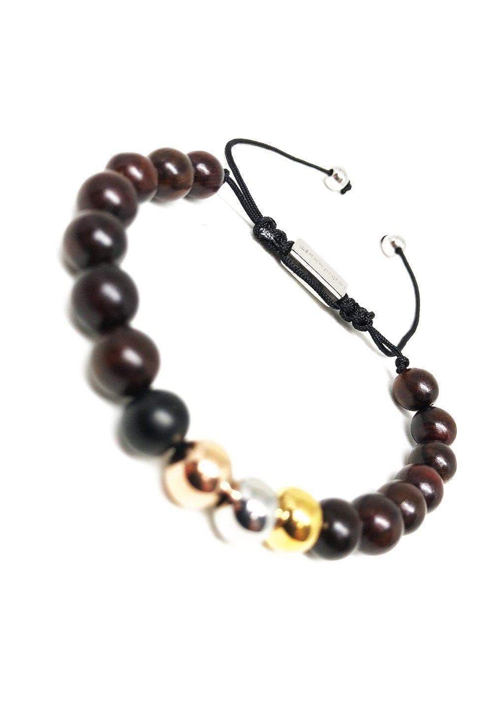 The Palm Band bead bracelet featuring colorful beads and a palm tree anchor link, symbolizing positivity and happiness.