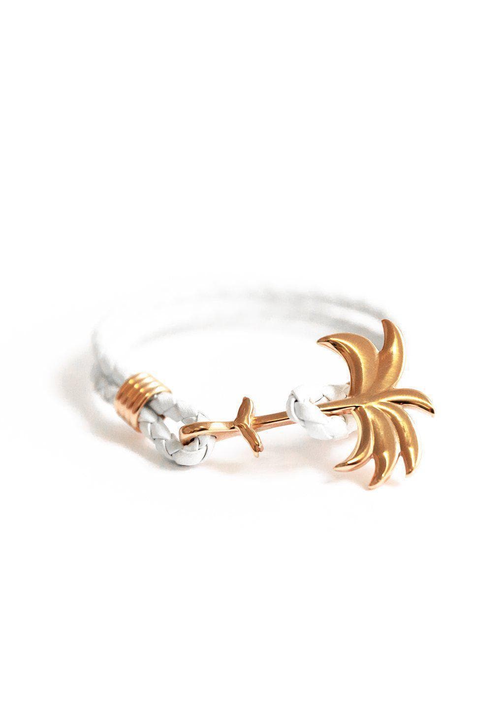 The Palm Band - Paradise Rose featuring a rose gold palm tree charm on a white braided leather bracelet, symbolizing positivity and happiness.