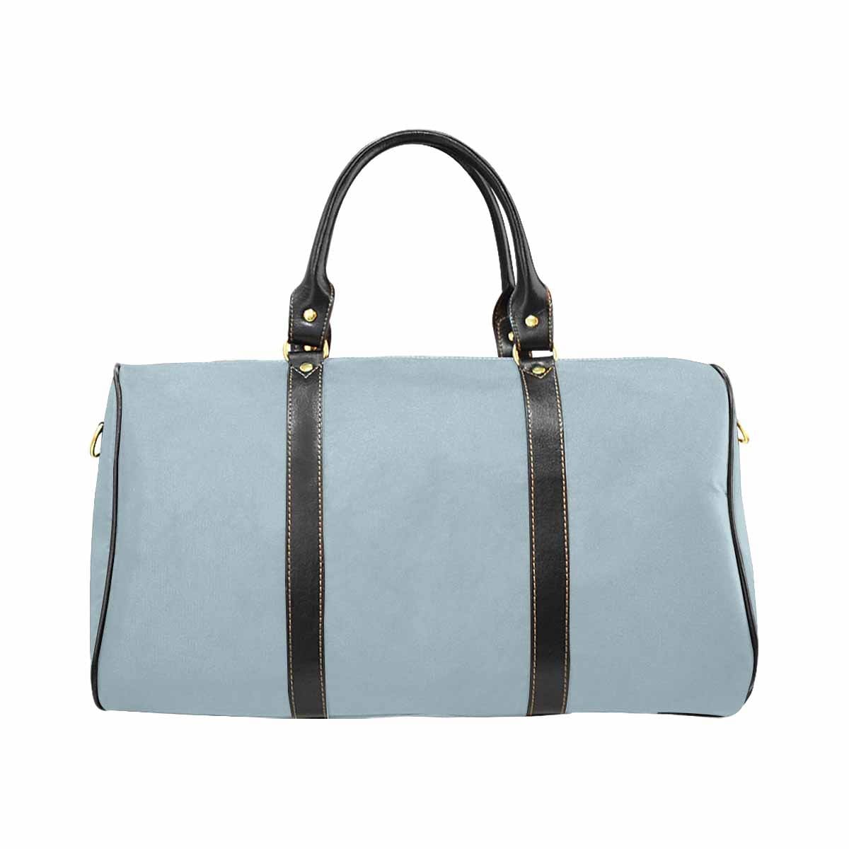 Pastel blue travel bag with adjustable black strap, showcasing its spacious design and durable waterproof fabric.