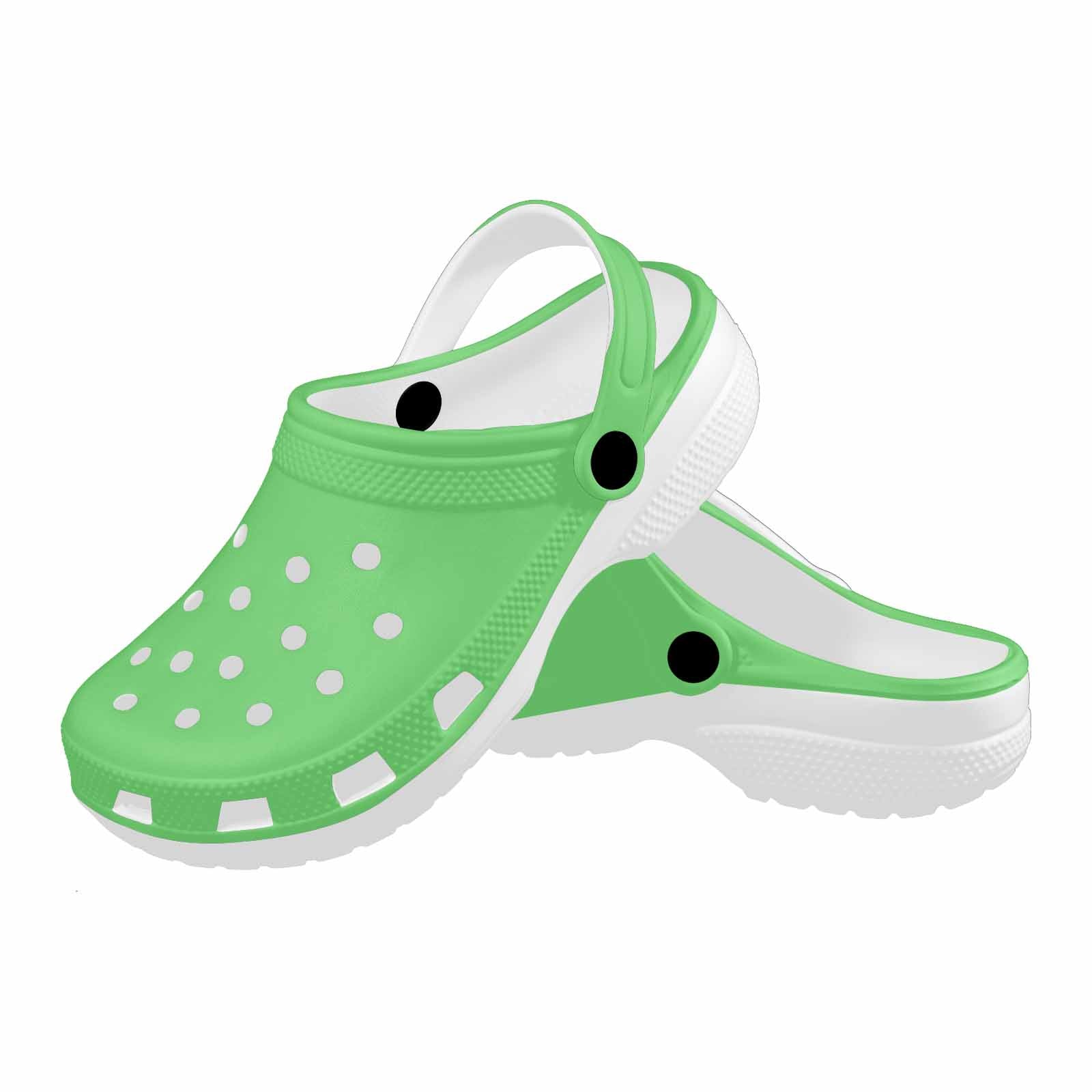 Pastel green adult clogs made from lightweight EVA material, featuring ventilation ports and pivoting heel straps for a secure fit.