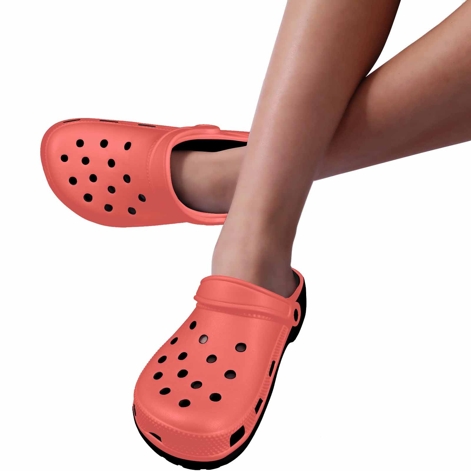 Pastel Red Adult Clogs showcasing lightweight EVA material and ventilation ports for breathability.