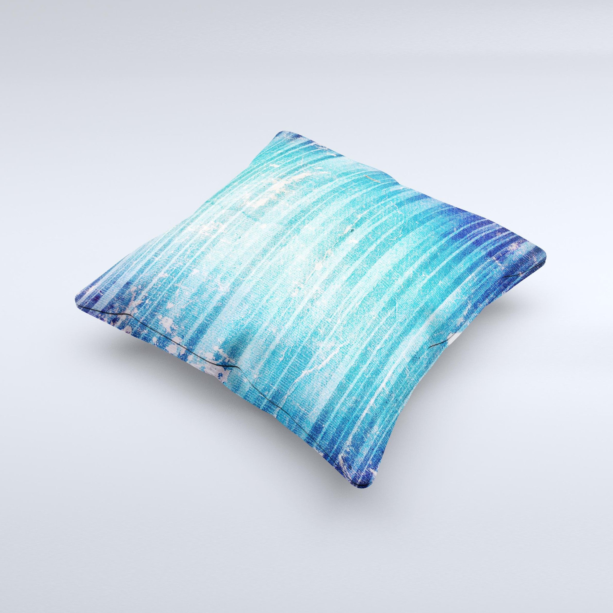 A vibrant blue decorative throw pillow with a unique patchy folded design, handcrafted in Virginia, showcasing artistic ink-fused graphics.