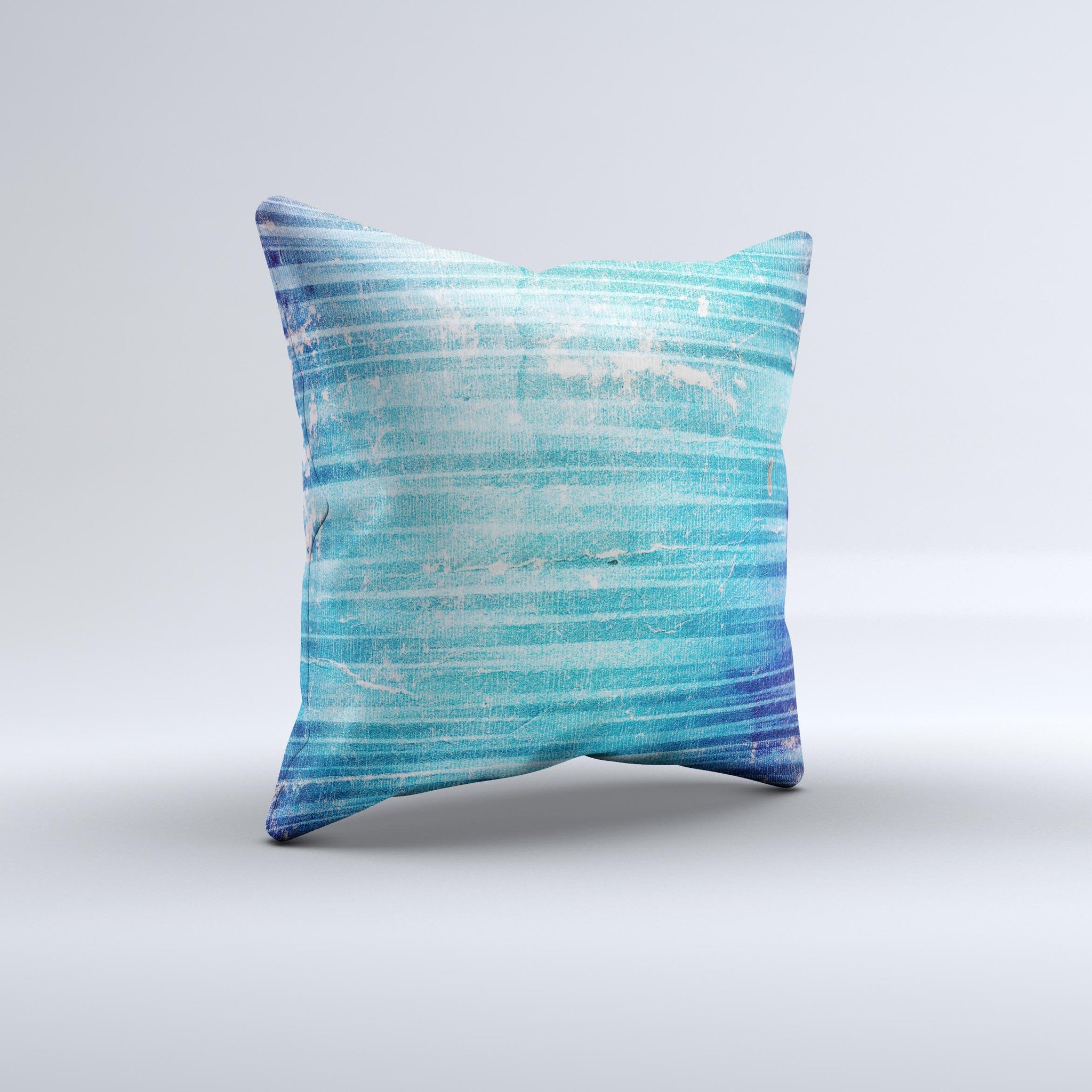 A vibrant blue decorative throw pillow with a unique patchy folded design, handcrafted in Virginia, showcasing artistic ink-fused graphics.