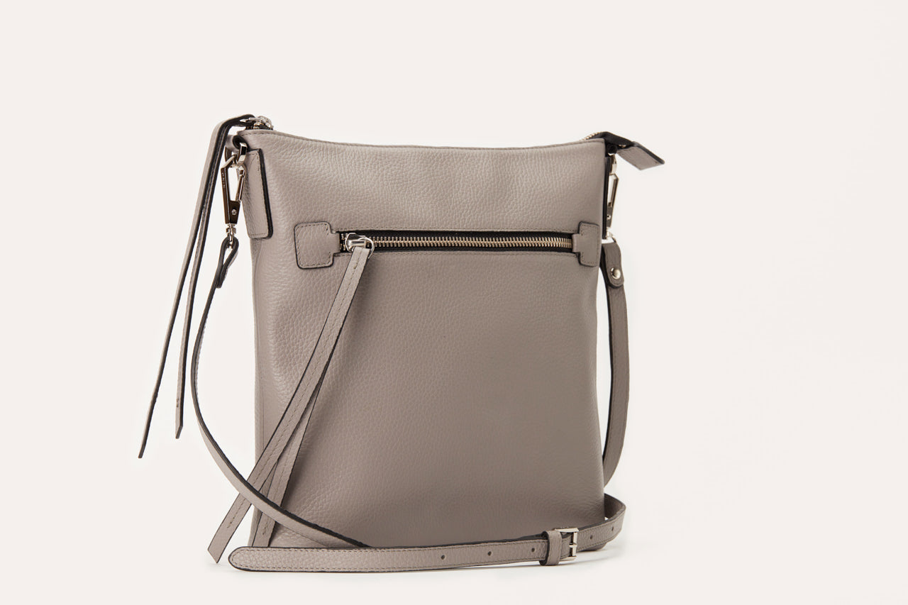 Stylish Pebble Crossbody bag made from genuine pebble leather, featuring an external zipper pocket and adjustable shoulder strap.