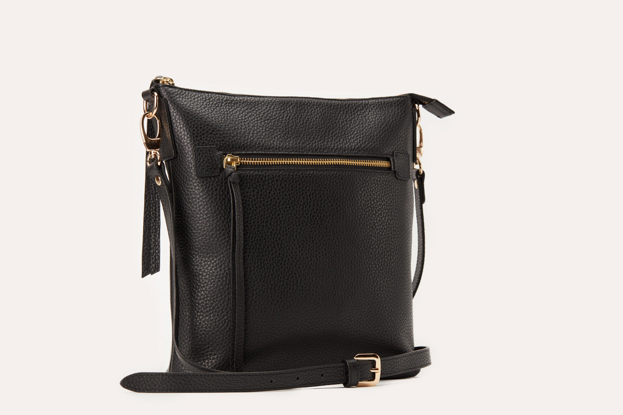 Stylish Pebble Crossbody bag made from genuine pebble leather, featuring an external zipper pocket and adjustable shoulder strap.