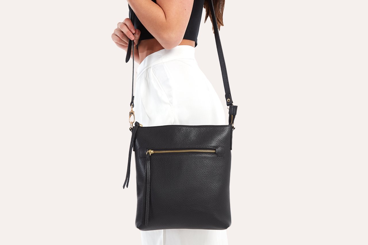 Stylish Pebble Crossbody bag made from genuine pebble leather, featuring an external zipper pocket and adjustable shoulder strap.