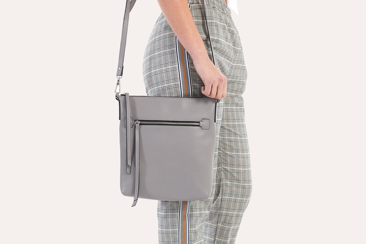 Stylish Pebble Crossbody bag made from genuine pebble leather, featuring an external zipper pocket and adjustable shoulder strap.