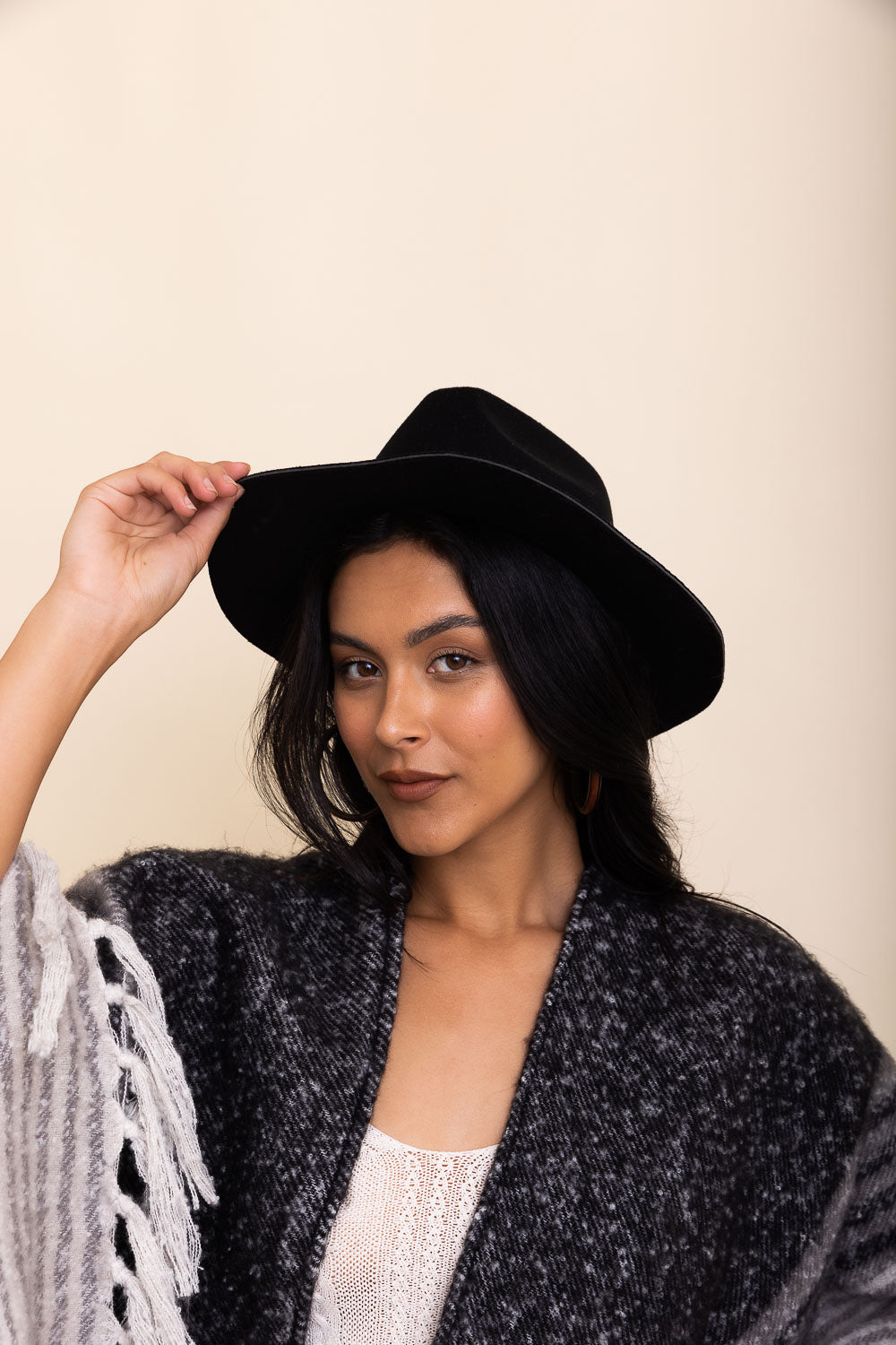 A stylish pinched front western style hat made of 100% polyester, perfect for adding flair to any outfit.