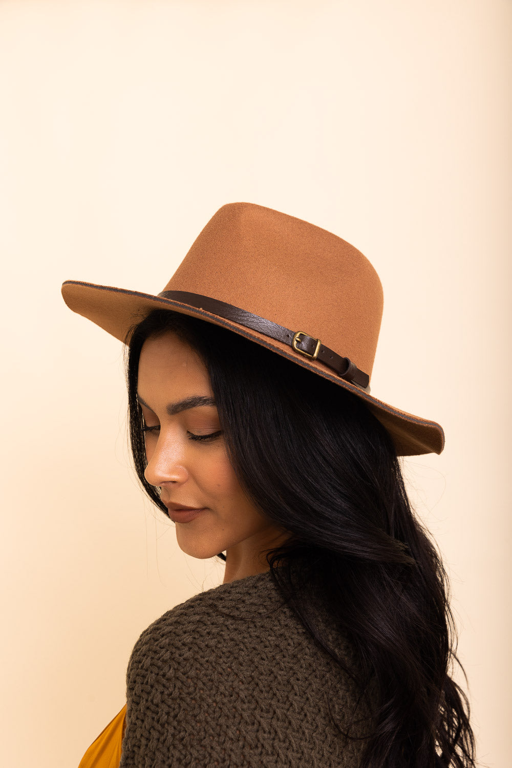 A stylish pinched front western style hat made of 100% polyester, perfect for adding flair to any outfit.