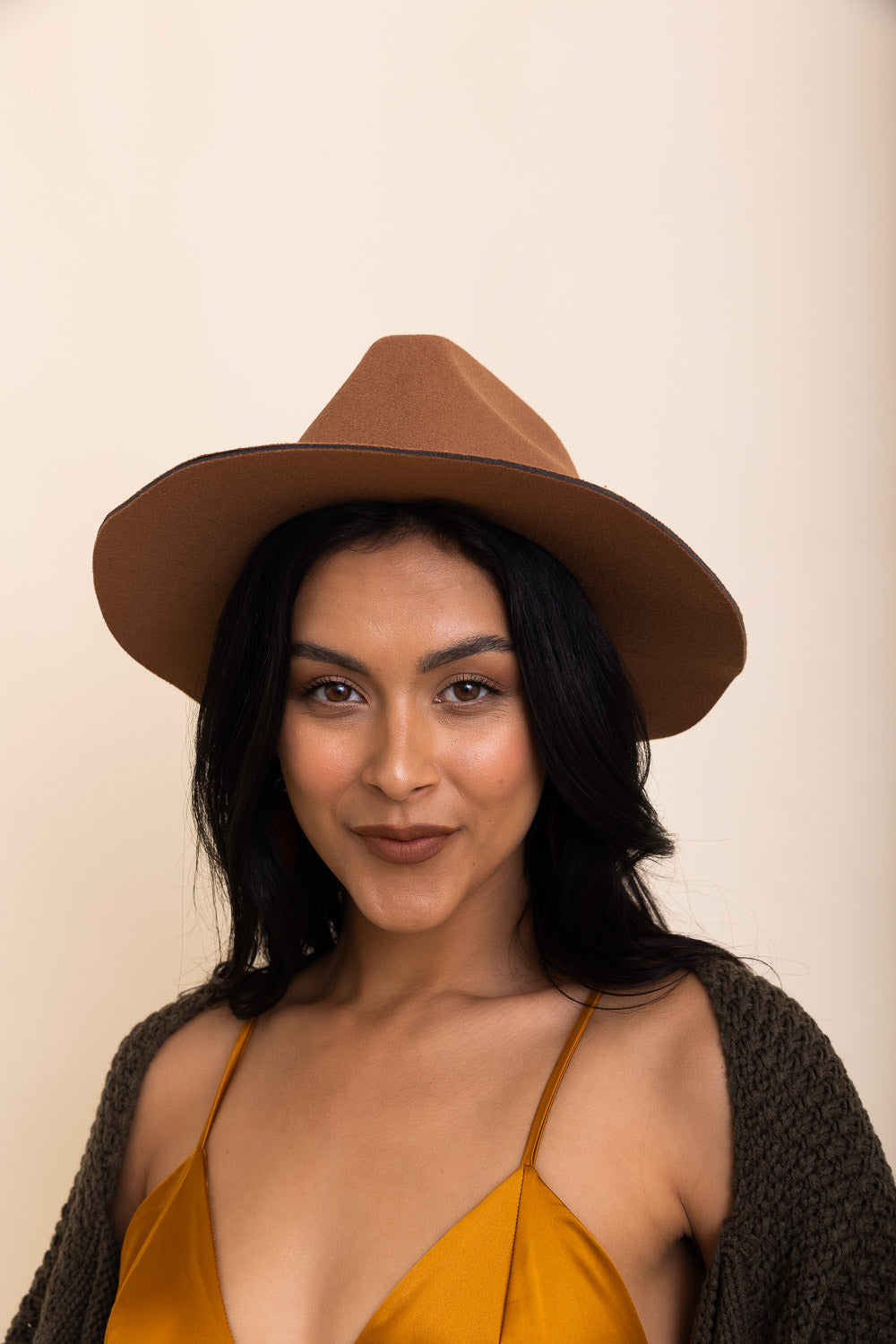 A stylish pinched front western style hat made of 100% polyester, perfect for adding flair to any outfit.