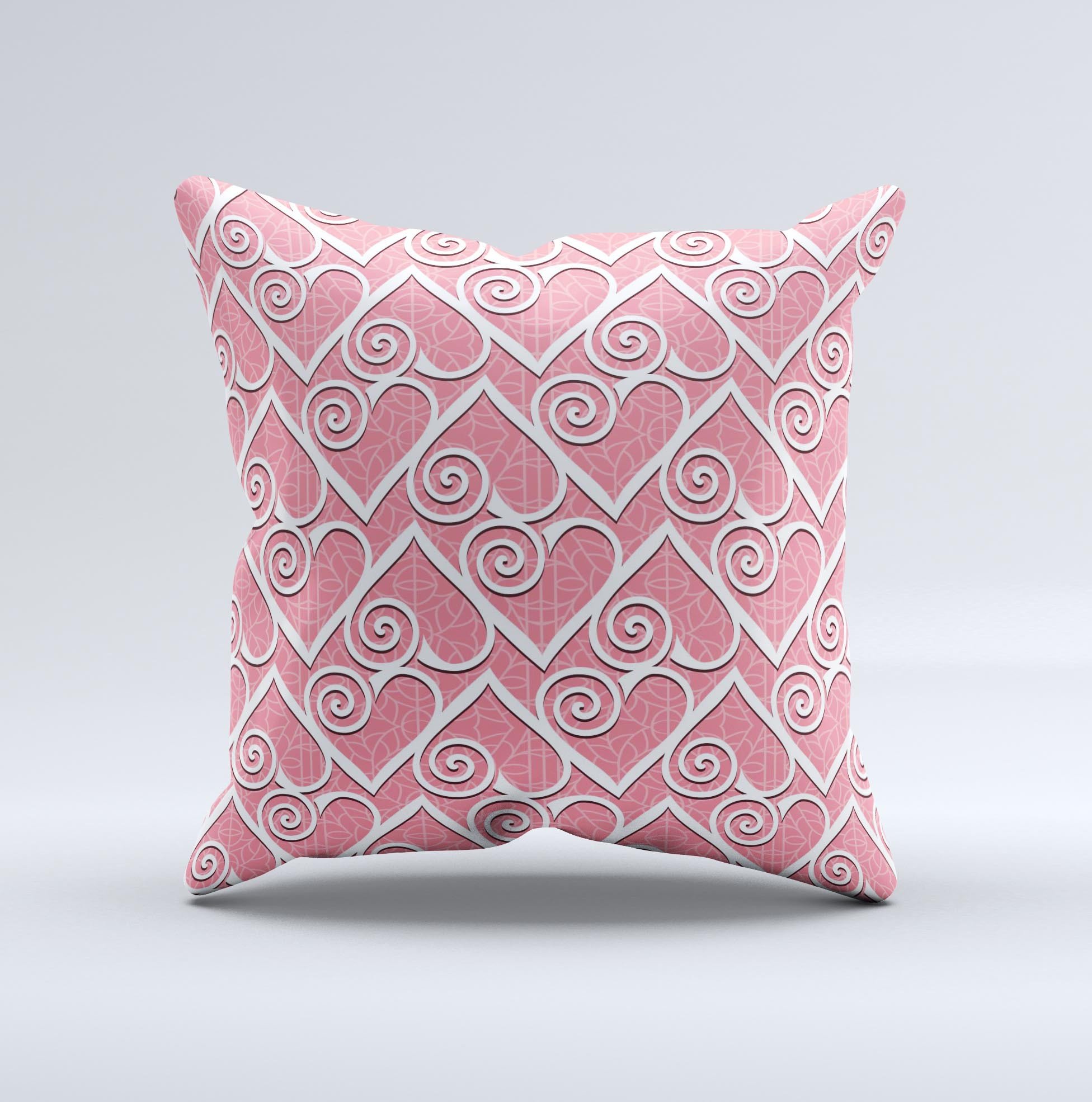 A decorative throw pillow featuring a pink and white swirly heart design, handcrafted with high-quality materials for comfort and style.