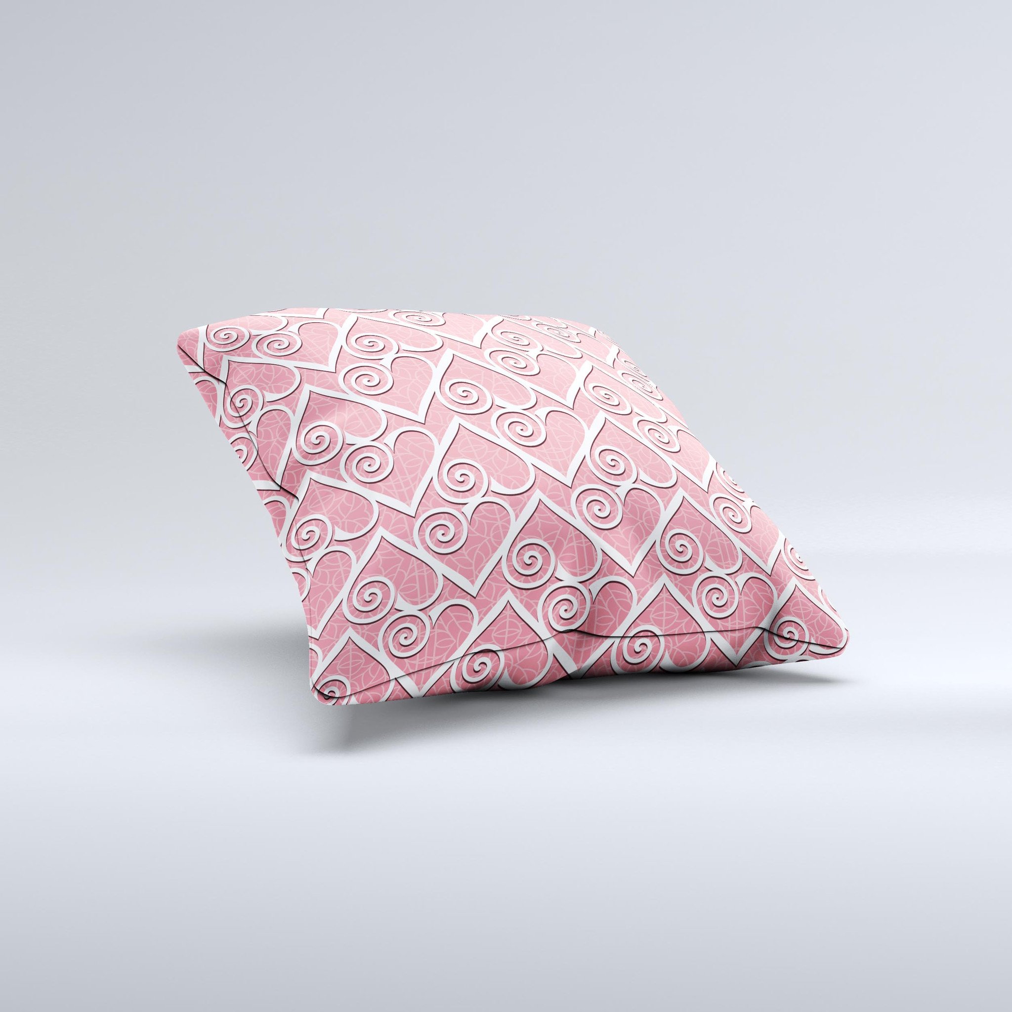 A decorative throw pillow featuring a pink and white swirly heart design, handcrafted with high-quality materials for comfort and style.