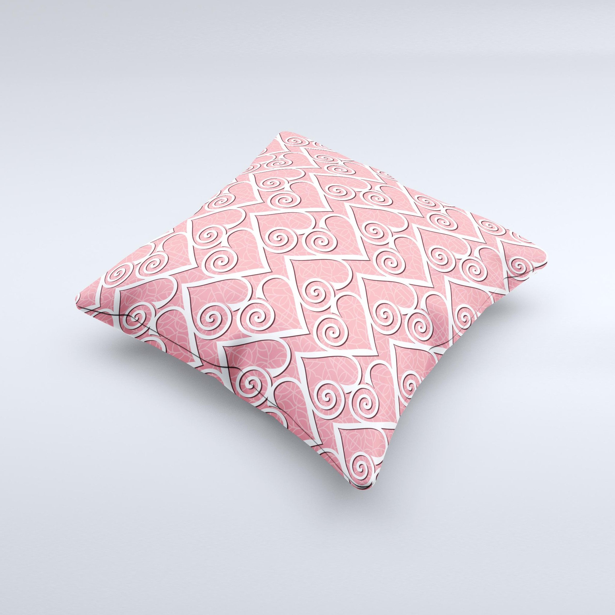 A decorative throw pillow featuring a pink and white swirly heart design, handcrafted with high-quality materials for comfort and style.