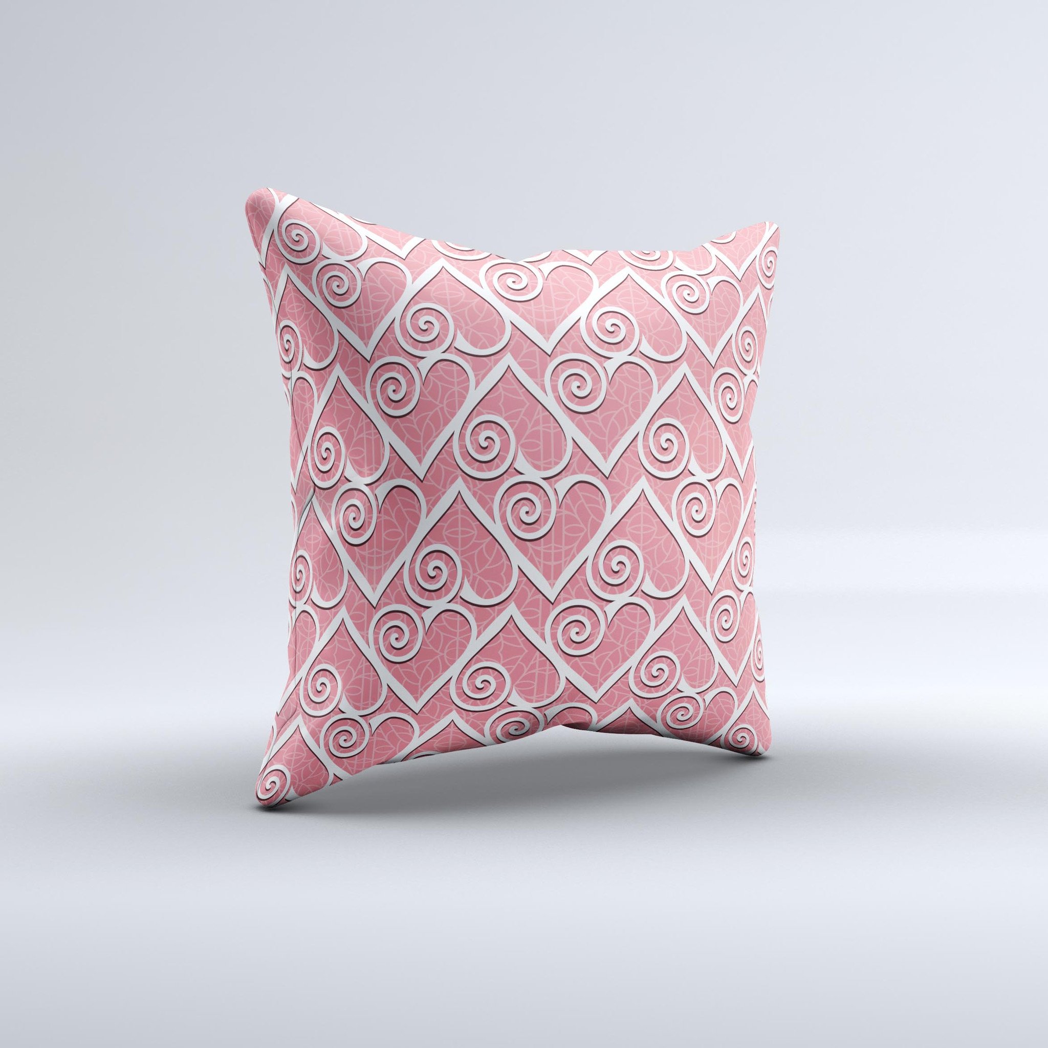 A decorative throw pillow featuring a pink and white swirly heart design, handcrafted with high-quality materials for comfort and style.