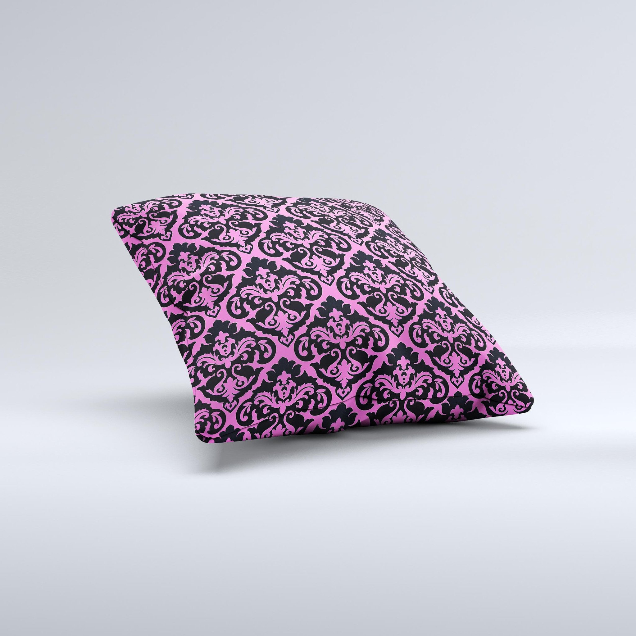 Pink and black decorative throw pillow with a delicate pattern, handcrafted in Virginia, showcasing unique ink-fuzed design.