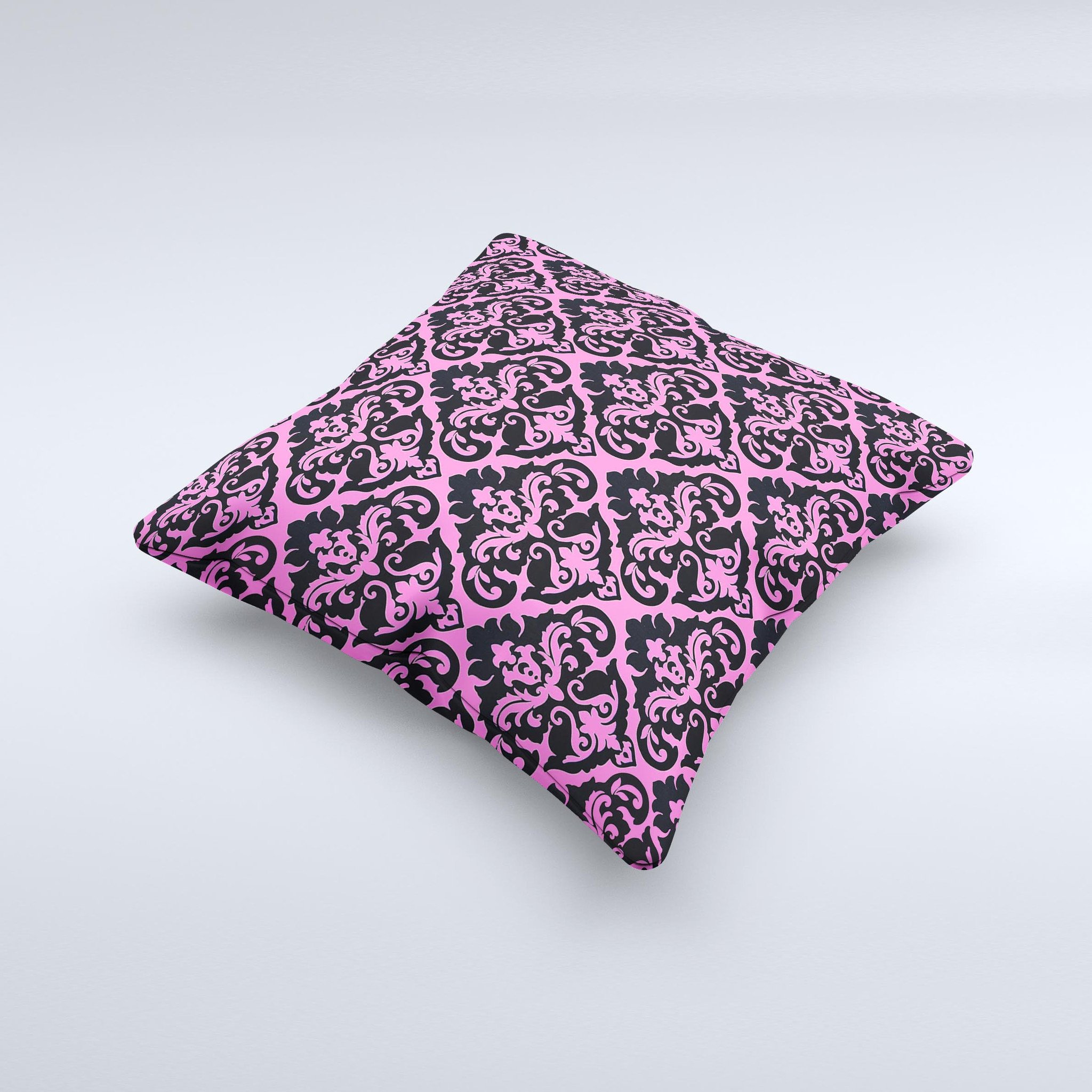 Pink and black decorative throw pillow with a delicate pattern, handcrafted in Virginia, showcasing unique ink-fuzed design.