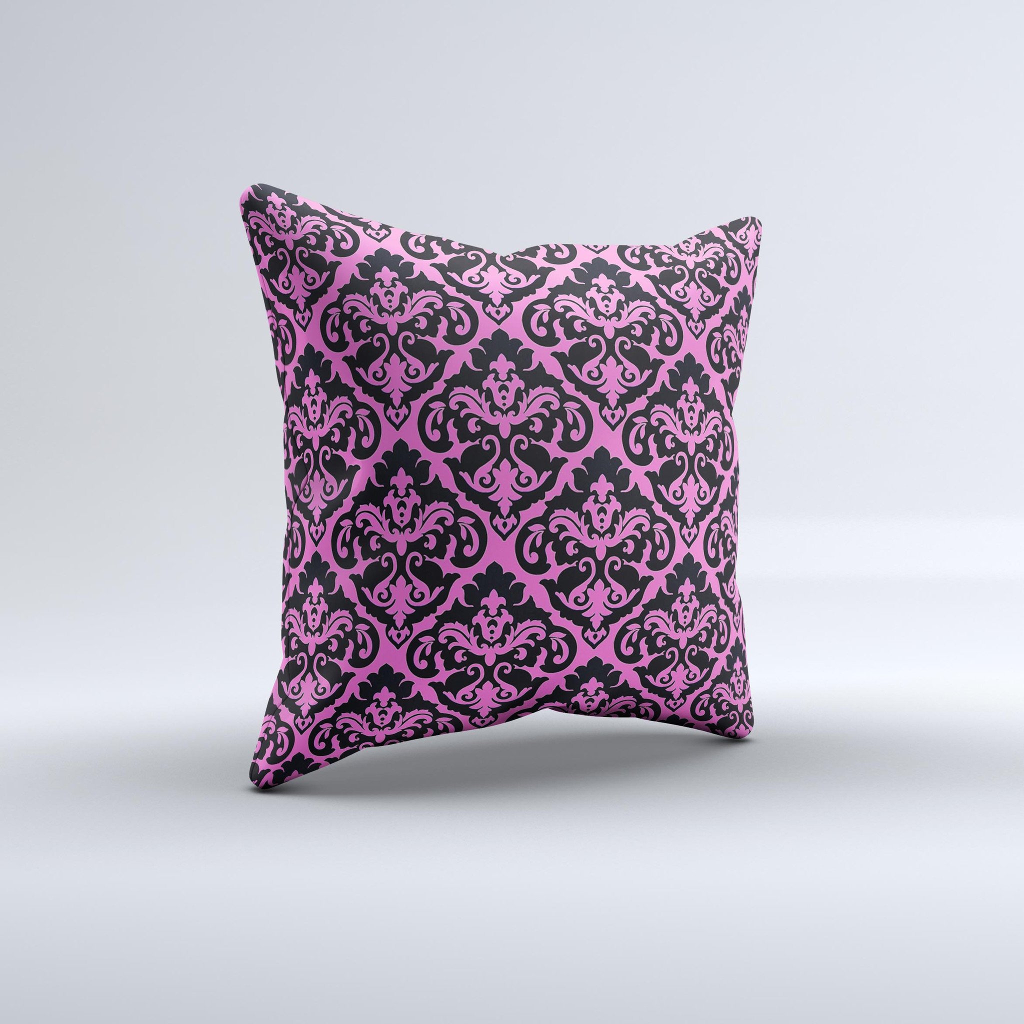 Pink and black decorative throw pillow with a delicate pattern, handcrafted in Virginia, showcasing unique ink-fuzed design.