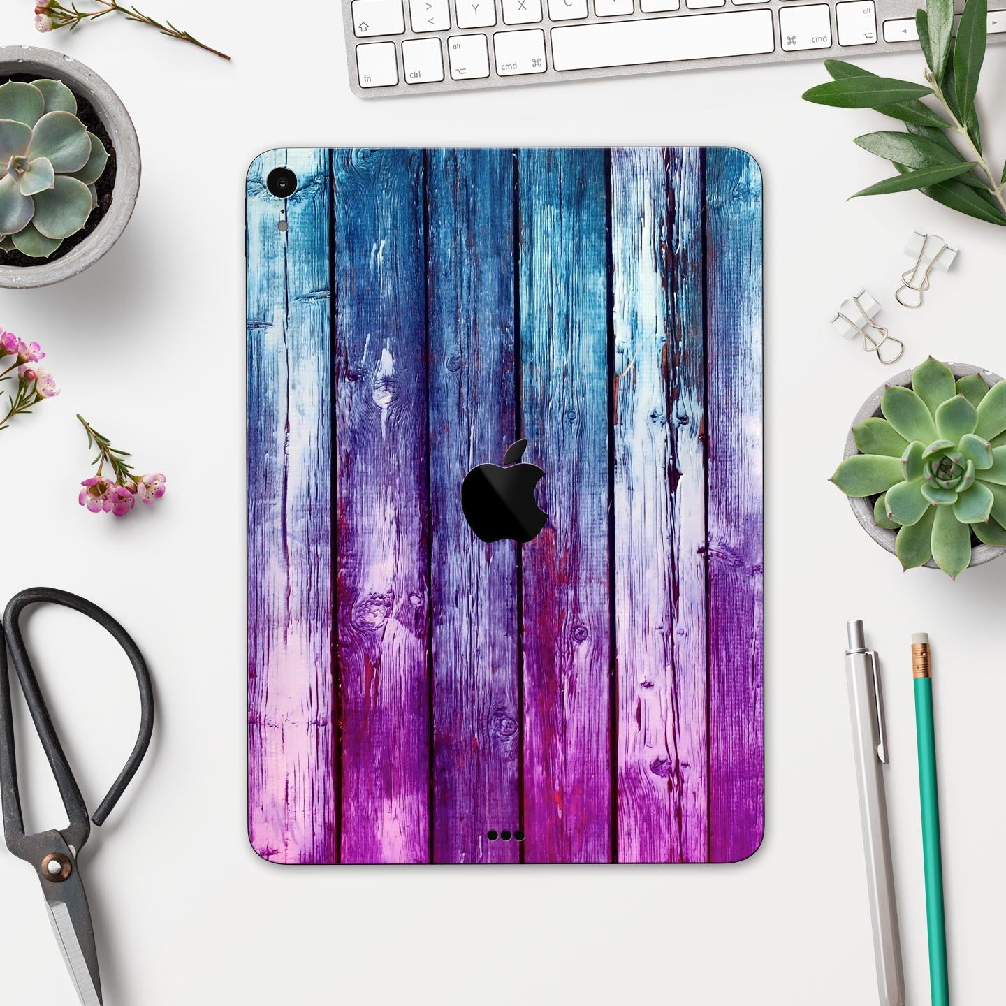 Pink and blue dyed wood skin decal for Apple iPad Pro, showcasing vibrant colors and a sleek design.