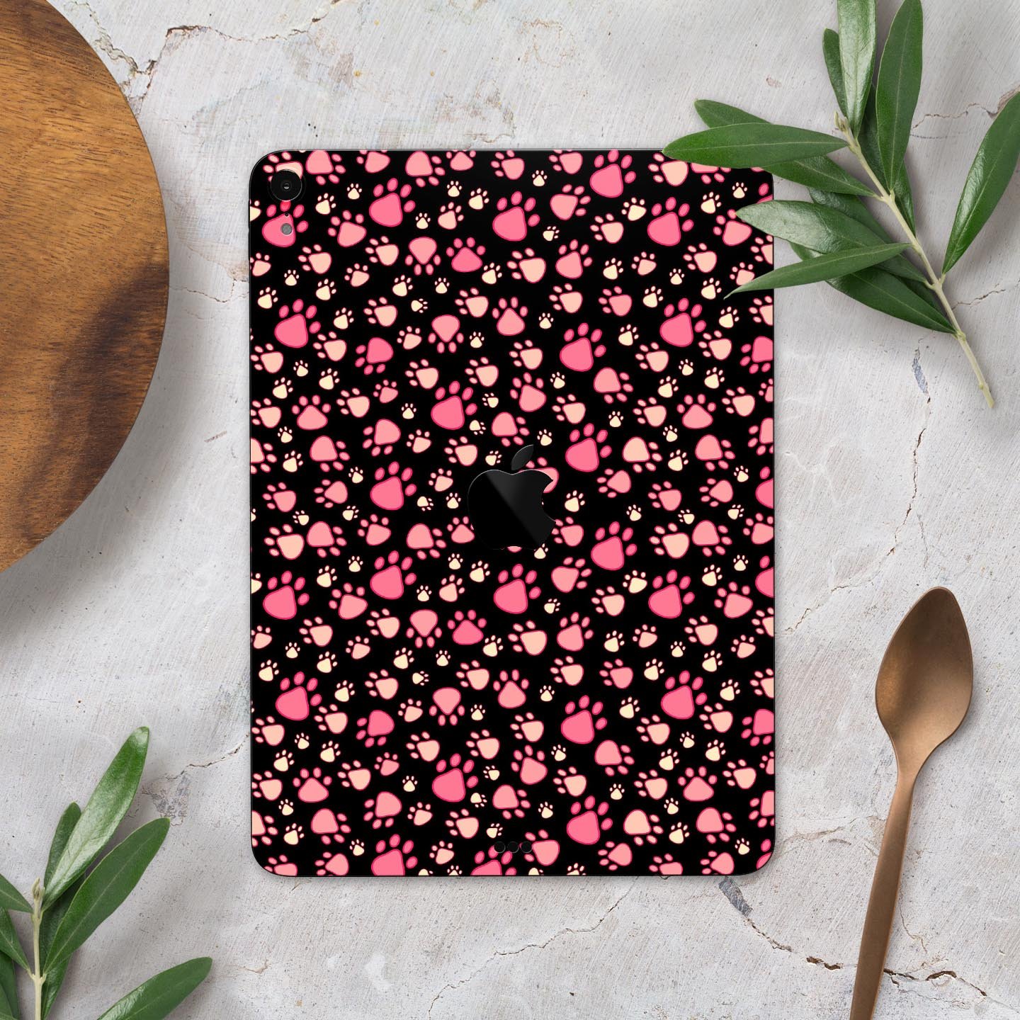 Full body skin decal featuring pink paw prints on a black background designed for Apple iPad Pro, showcasing its stylish and protective features.