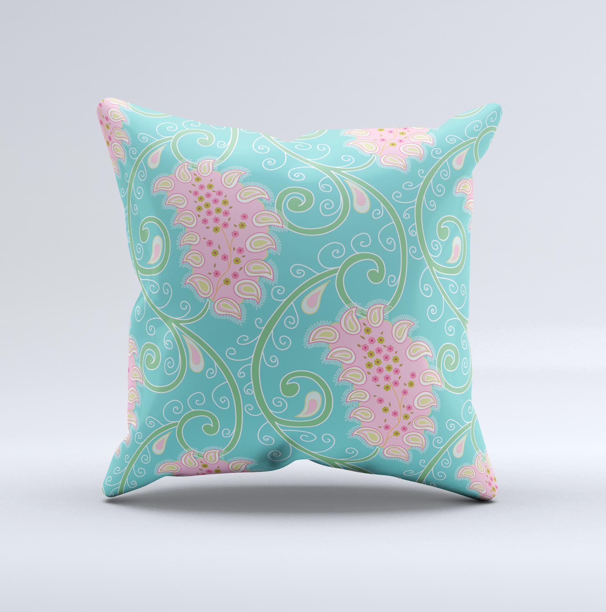 Pink and teal decorative throw pillow featuring a paisley design, handcrafted in Virginia with high thread count fabric and plush polyester filling.