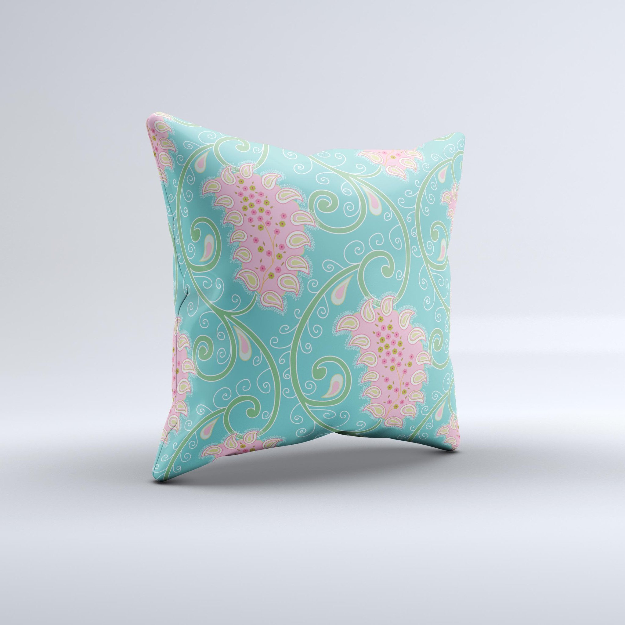 Pink and teal decorative throw pillow featuring a paisley design, handcrafted in Virginia with high thread count fabric and plush polyester filling.