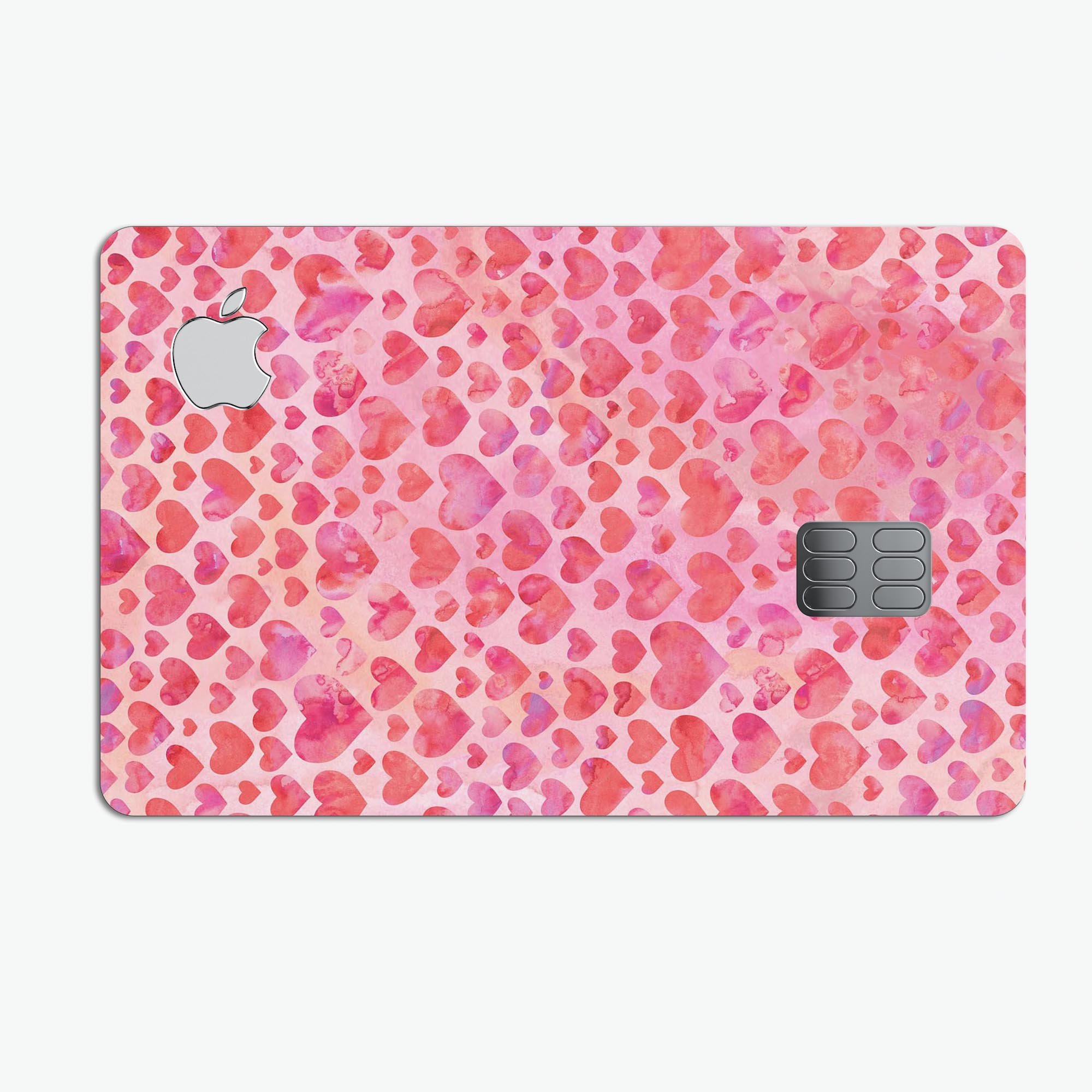 Pink Watercolor Hearts V2 decal skin for Apple Card, showcasing vibrant heart designs on a protective vinyl surface.