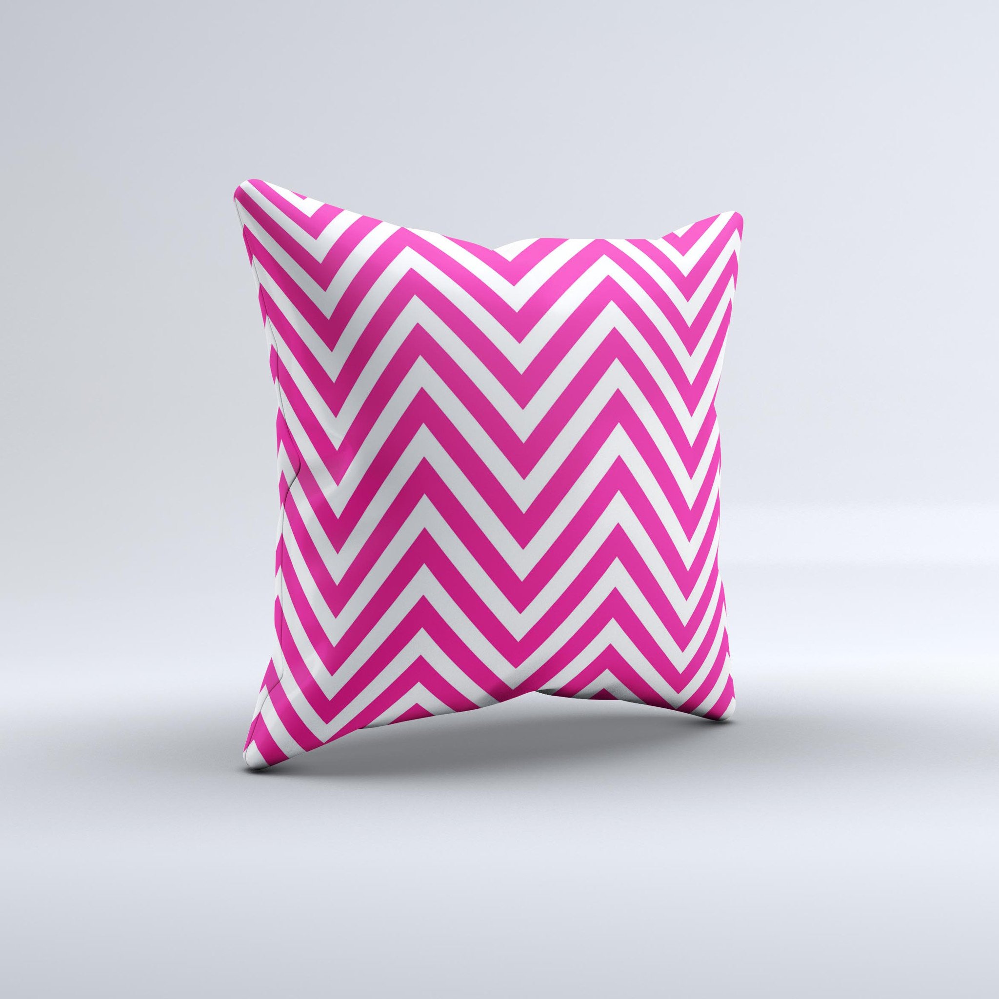 Pink and white decorative throw pillow featuring a sharp chevron pattern, handcrafted in Virginia with high-quality materials.