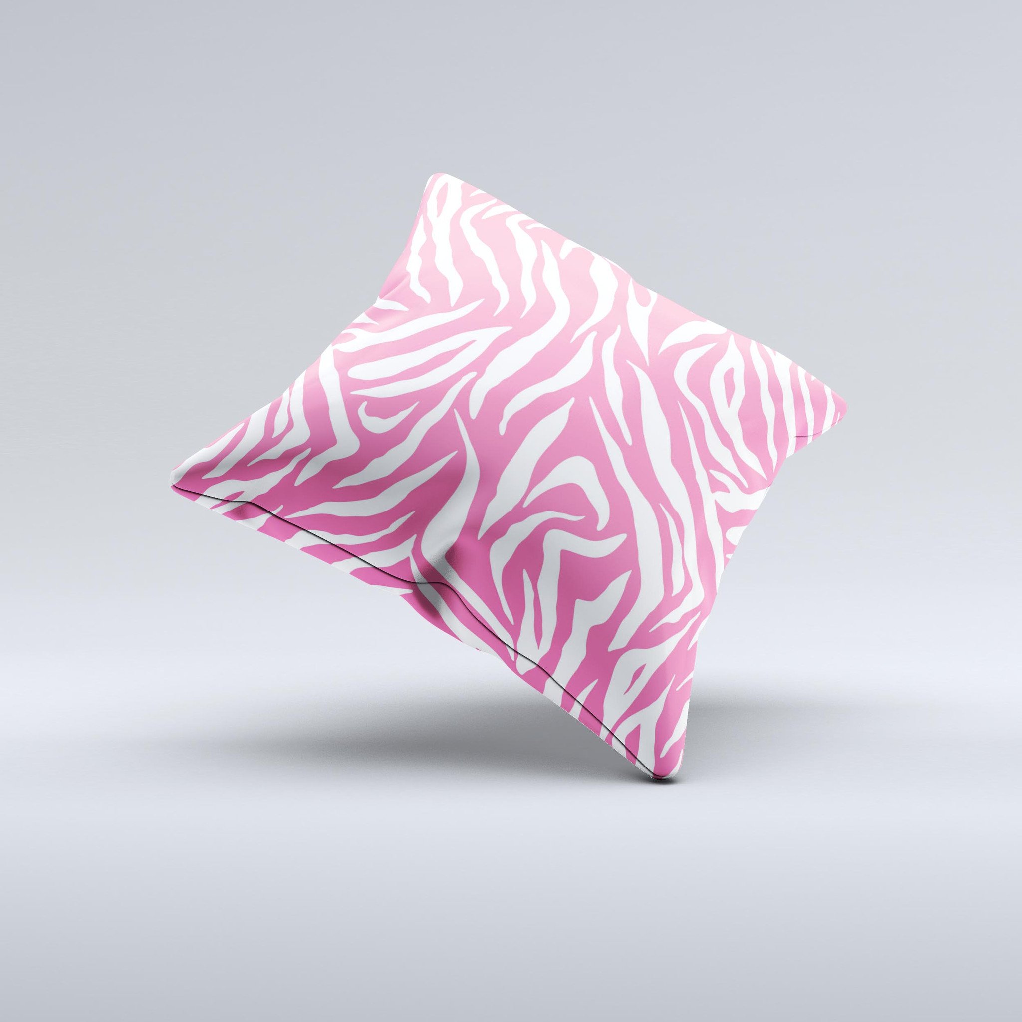 Pink and white decorative throw pillow featuring a unique zebra print design, handcrafted in Virginia with high-quality materials.