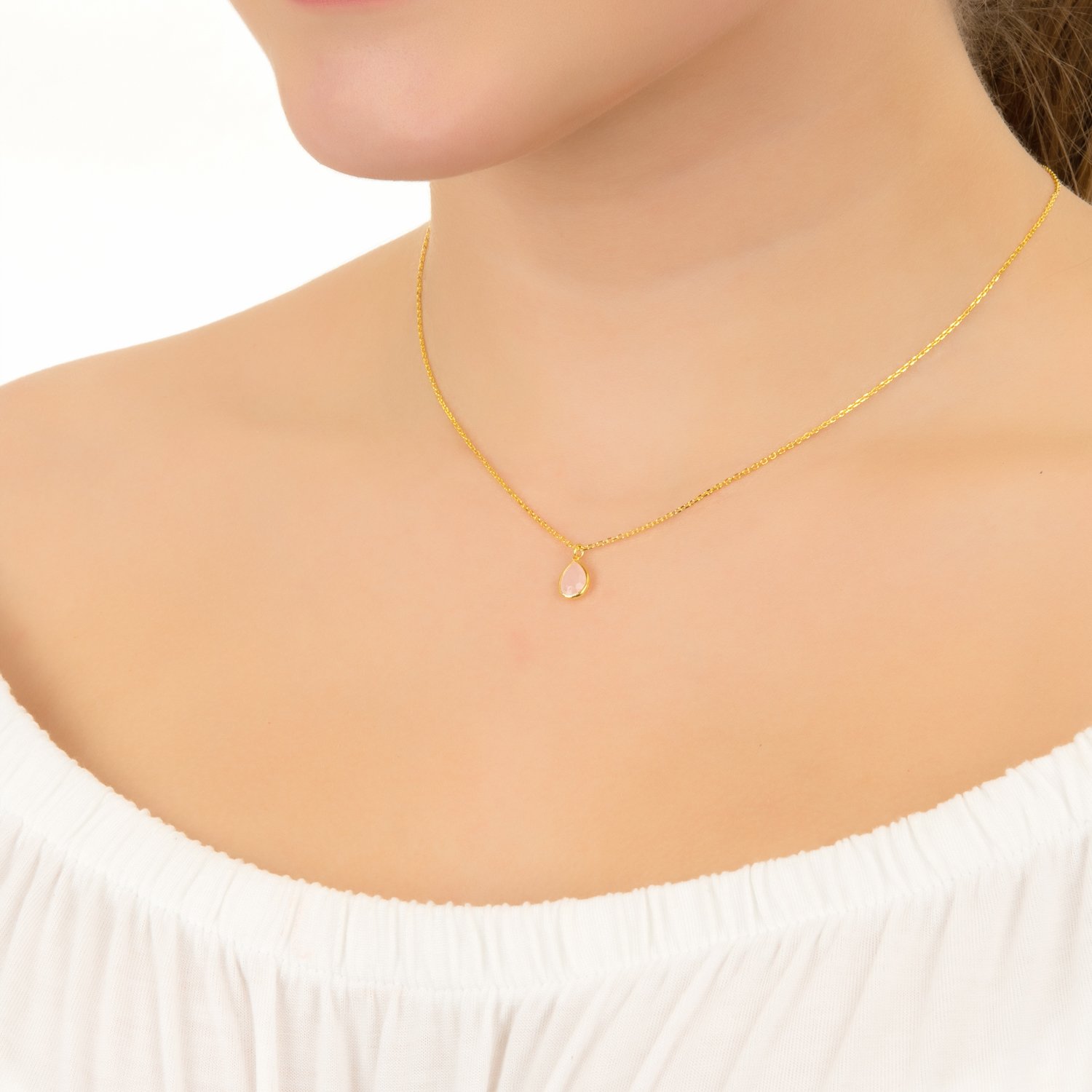 Pisa Mini Teardrop Necklace in Gold featuring a Blue Topaz gemstone, elegantly designed with a fine chain and adjustable length.