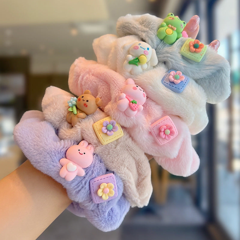 A colorful set of five plush toys and matching scrunchies, showcasing their soft textures and playful designs.