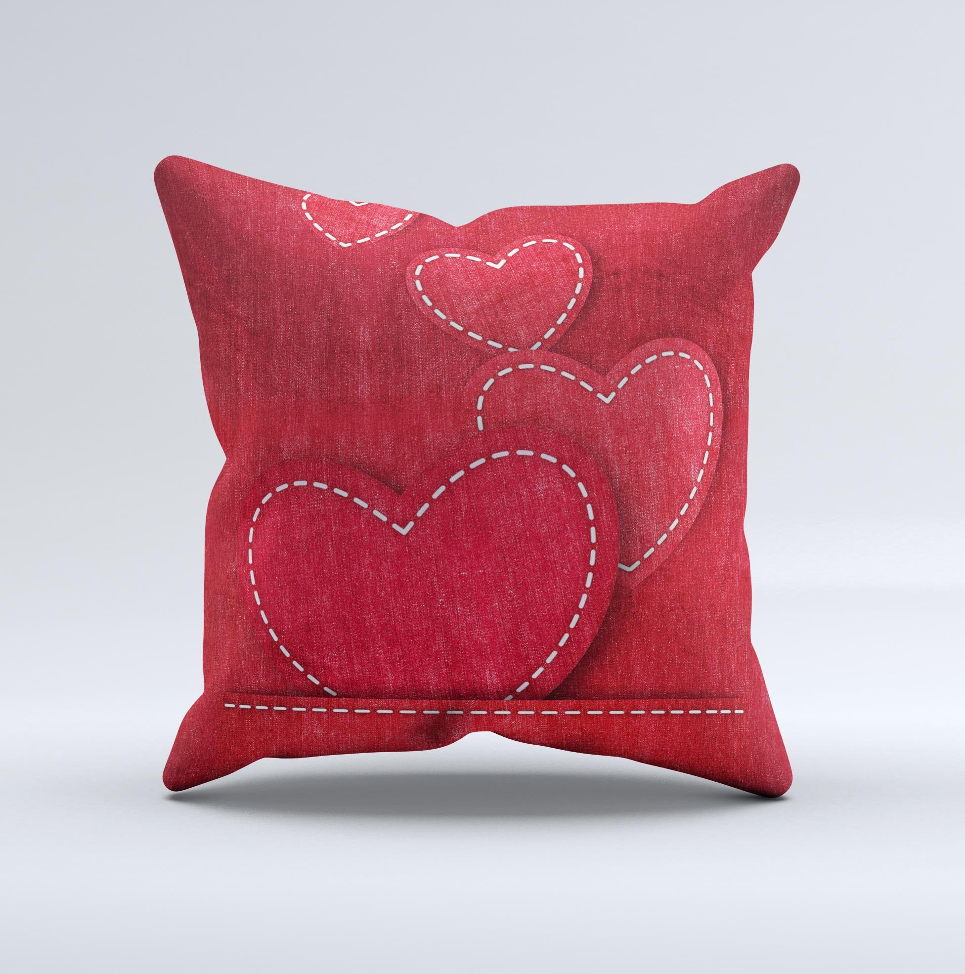 Handcrafted decorative throw pillow featuring red scratched hearts design on a soft poly/cotton fabric.