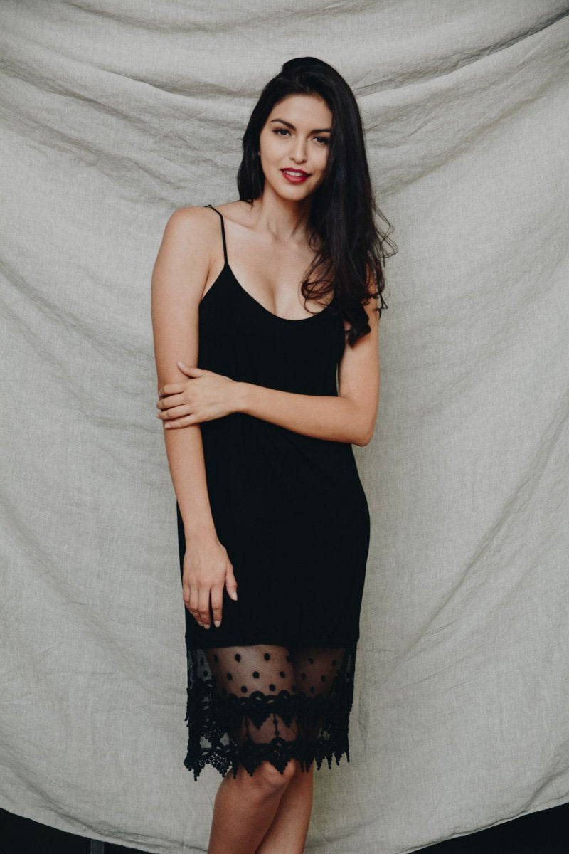 A stylish Polkadot Lace Slip Dress featuring intricate lace trim, perfect for various occasions.