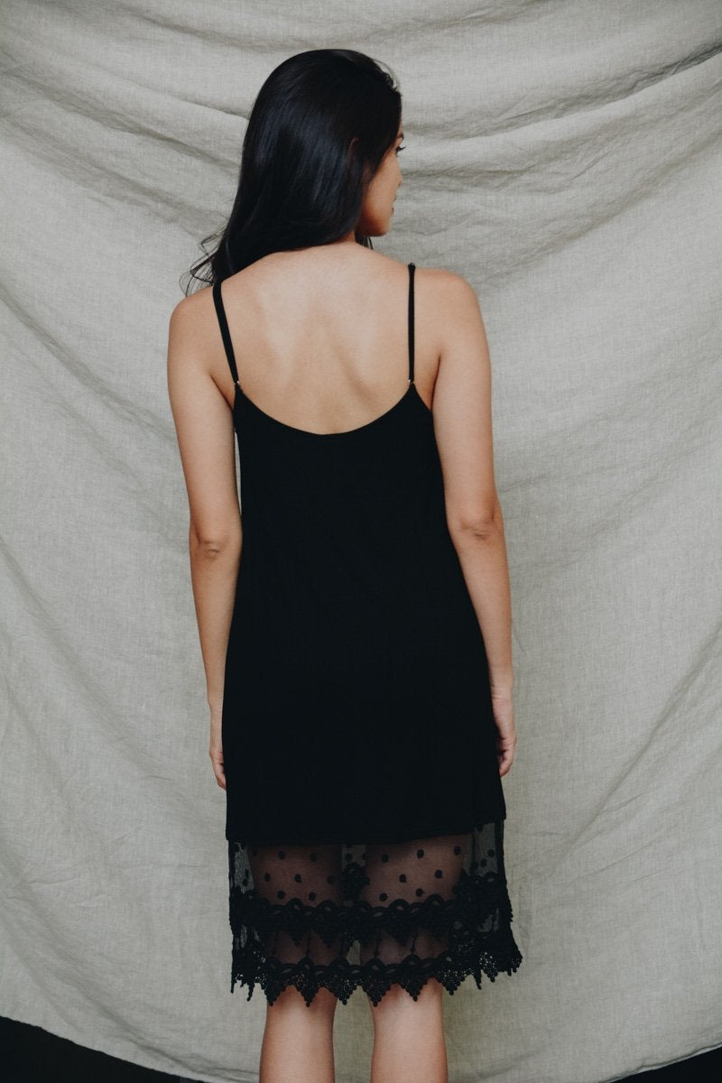 A stylish Polkadot Lace Slip Dress featuring intricate lace trim, perfect for various occasions.