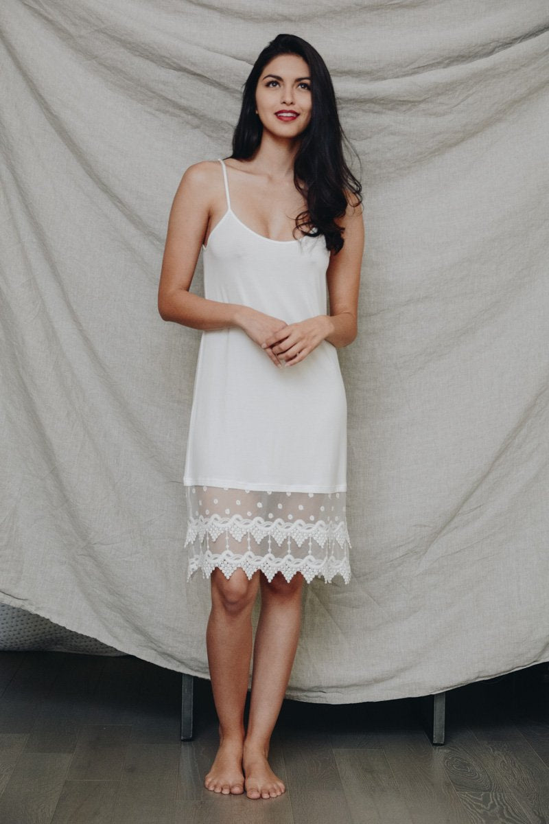 A stylish Polkadot Lace Slip Dress featuring intricate lace trim, perfect for various occasions.