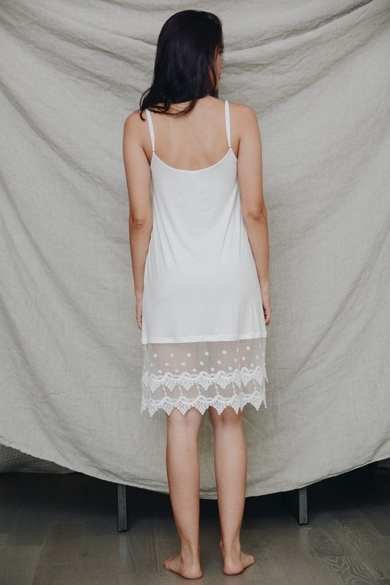 A stylish Polkadot Lace Slip Dress featuring intricate lace trim, perfect for various occasions.