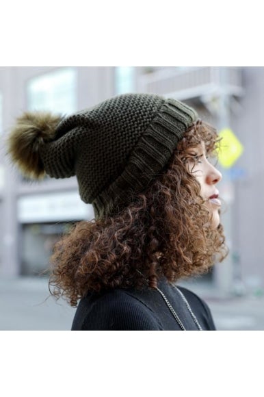 Cozy Pom Beanie with soft faux sherpa lining, perfect for winter wear.