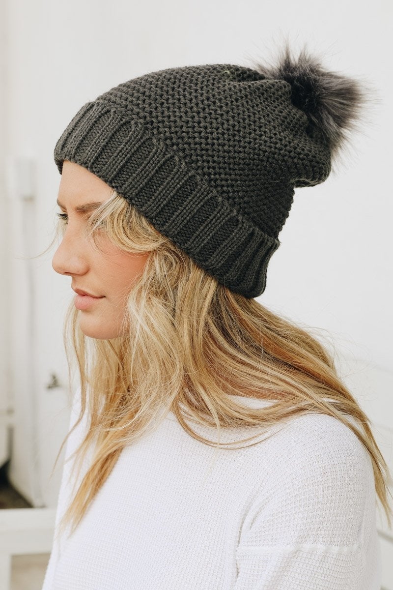 Cozy Pom Beanie with soft faux sherpa lining, perfect for winter wear.