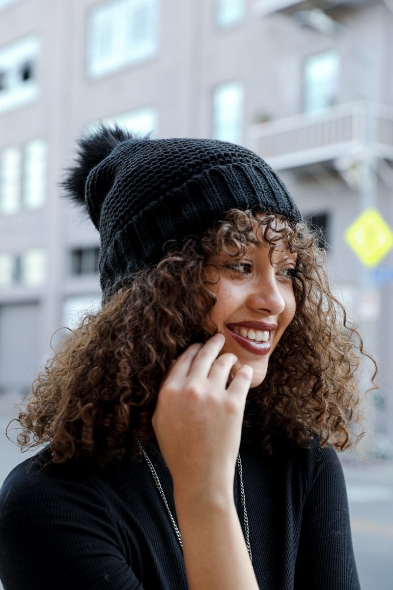 Cozy Pom Beanie with soft faux sherpa lining, perfect for winter wear.